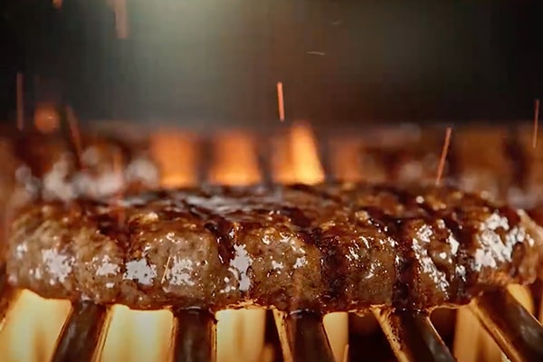 Hardee's angus burger with cheese, onion, tomato, and lettuce